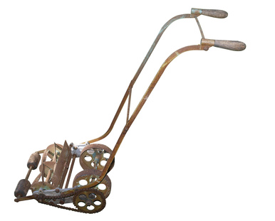 Rusty Antique Mower isolated with clipping path