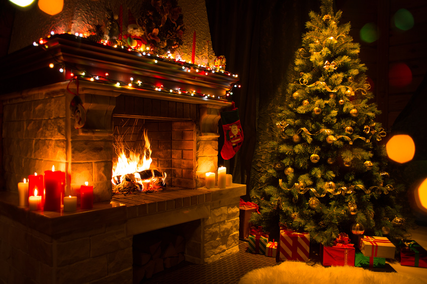 christmas tree with gifts near fireplace