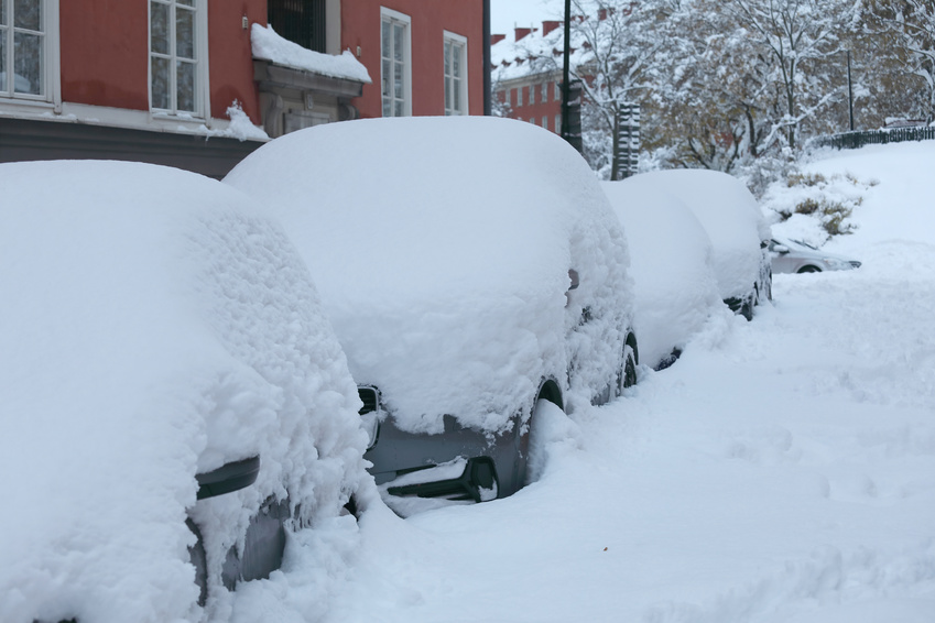 STOCKHOLM, SWEDEN - NOV 10, 2016: Snow chaos in the traffic in central Stockholm. Cars covered with snow November 10, 2016 in Stockholm, Sweden