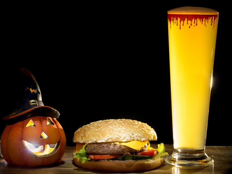 halloween pumpkin with halloween beer and cheeseburger