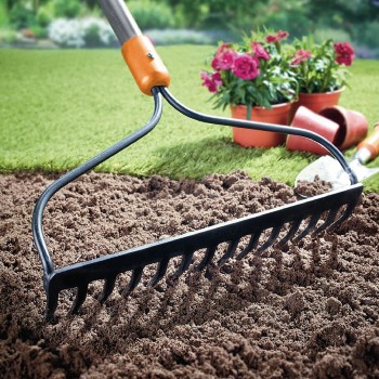 A rake smoothing-out a freshly-dug bed.
